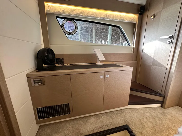 Yacht Photos Pics Interior of 2017 Prestige 500 yacht with modern cabinetry and window view.