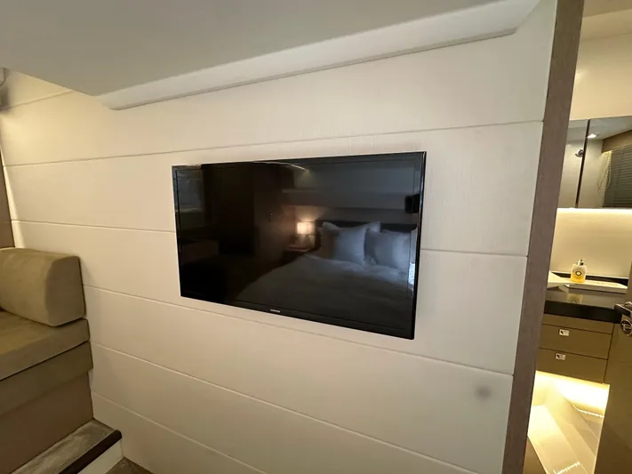  Yacht Photos Pics Flat-screen TV in 2017 Prestige 500 yacht interior, featuring modern design and cozy ambiance.