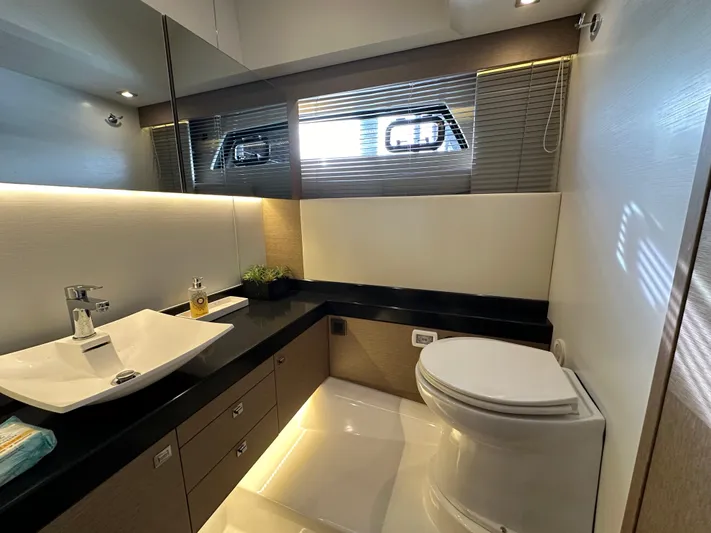  Yacht Photos Pics Luxurious bathroom in 2017 Prestige 500 yacht with modern fixtures and sleek design.