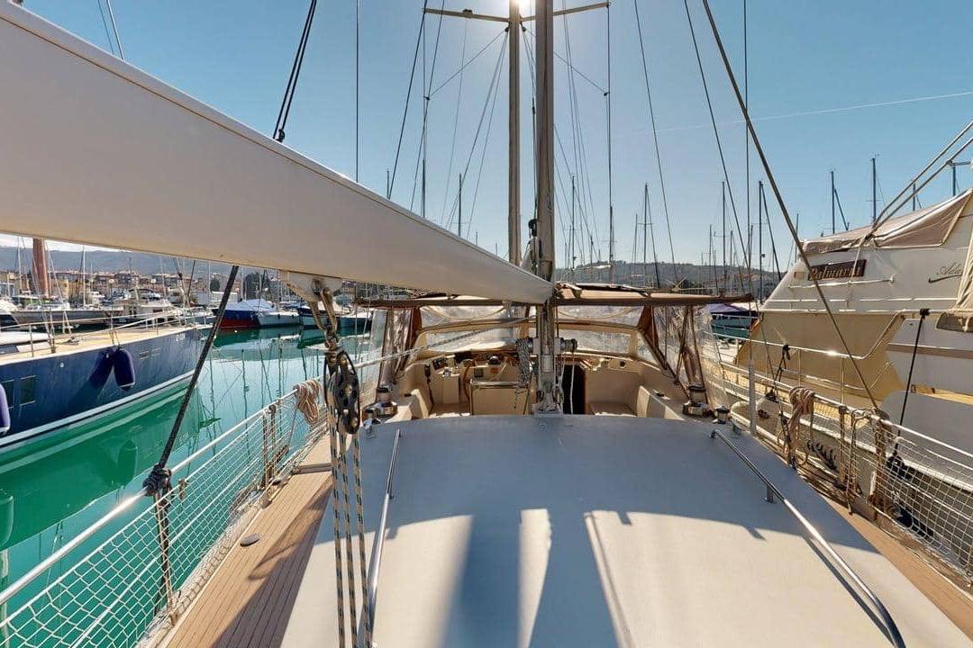 Sailing yacht Amel Super Maramu 2000, 2001 model, docked in a sunny marina.