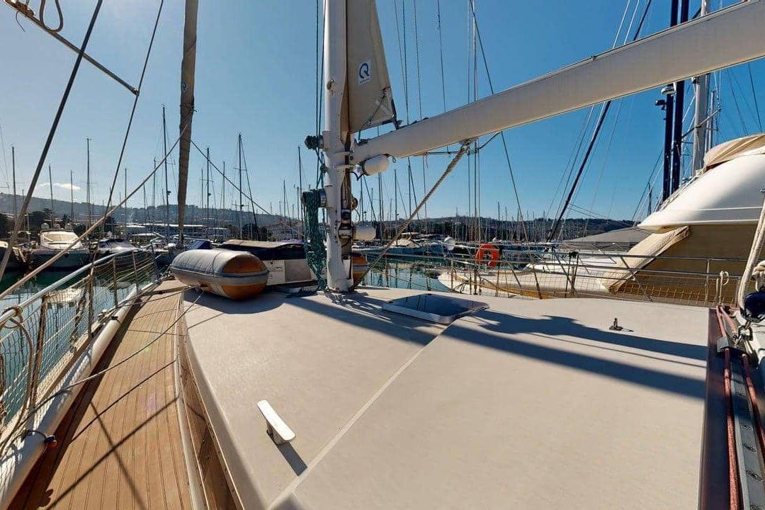 Sailing yacht Amel Super Maramu 2000, 2001 model, docked in a sunny marina.