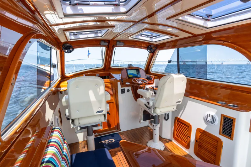 Sometimes Yacht Photos Pics Interior of 2007 Hinckley Picnic Boat EP with wooden finish and ocean view.