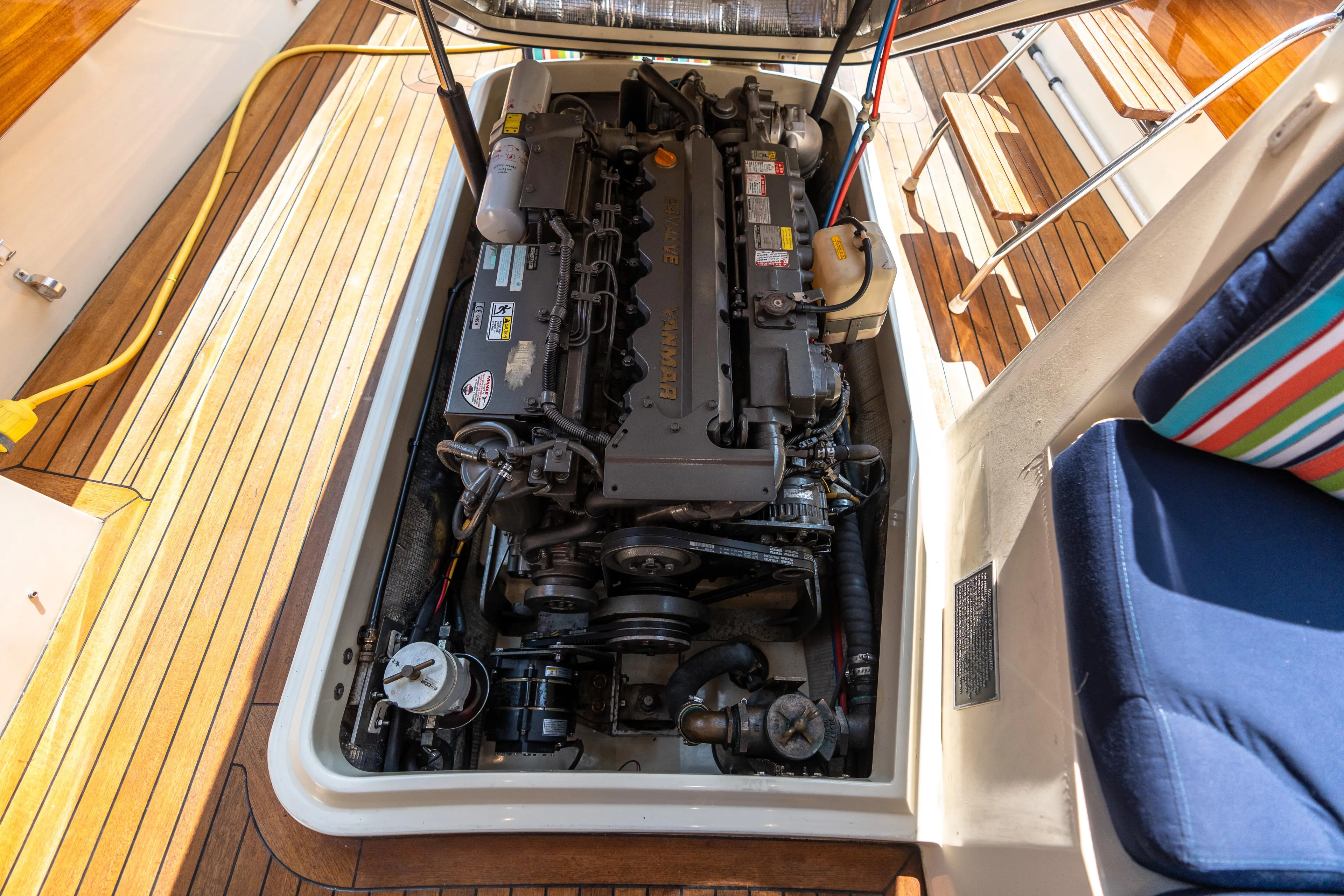 Sometimes Yacht Photos Pics Engine compartment of 2007 Hinckley Picnic Boat EP with visible mechanical components.