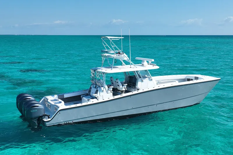  Yacht Photos Pics 2024 Freeman 42 boat on clear turquoise water, featuring multiple Yamaha engines.