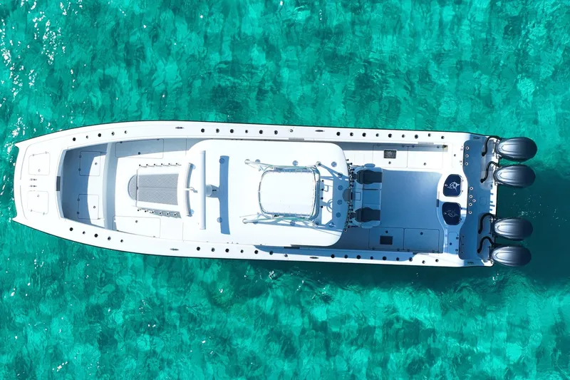  Yacht Photos Pics Aerial view of 2024 Freeman 42 boat on clear turquoise water.