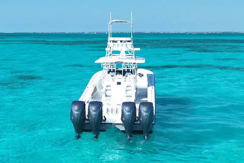  Yacht Photos Pics 2024 Freeman 42 boat with four engines on clear turquoise water.