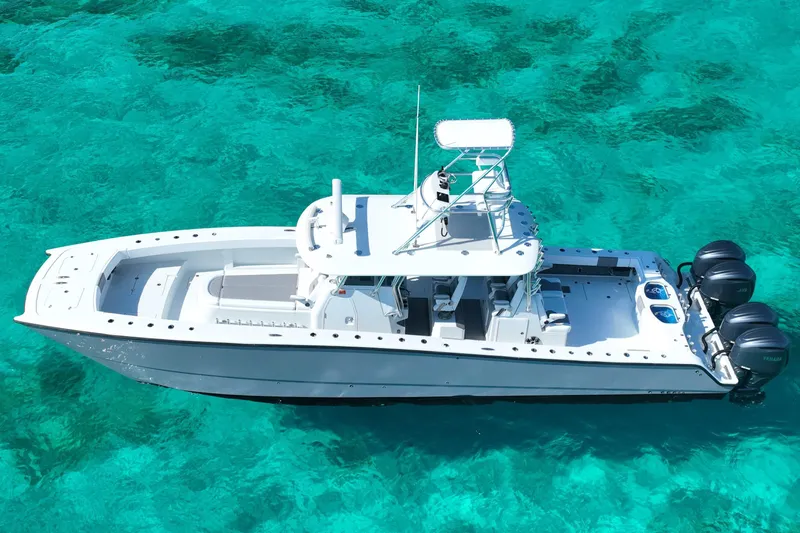  Yacht Photos Pics 2024 Freeman 42 boat on clear turquoise water, aerial view.