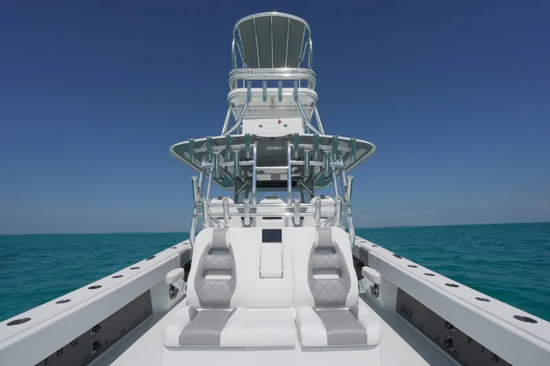  Yacht Photos Pics 2024 Freeman 42 boat on open sea, featuring sleek design and modern seating.