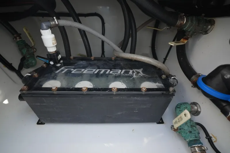  Yacht Photos Pics Engine compartment of 2024 Freeman 42 boat with visible hoses and components.