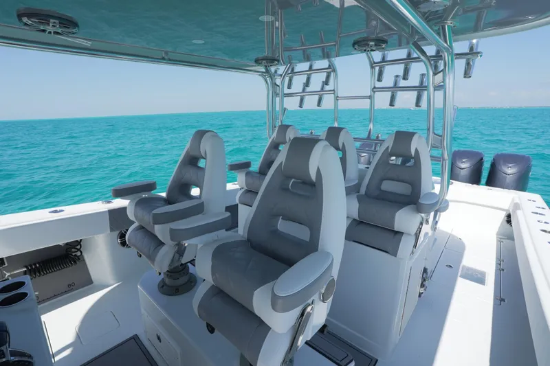  Yacht Photos Pics Luxury seating on 2024 Freeman 42 boat, overlooking turquoise ocean waters.