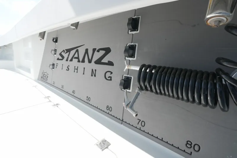  Yacht Photos Pics 2024 Freeman 42 boat deck with Stanz Fishing logo and coiled hose.