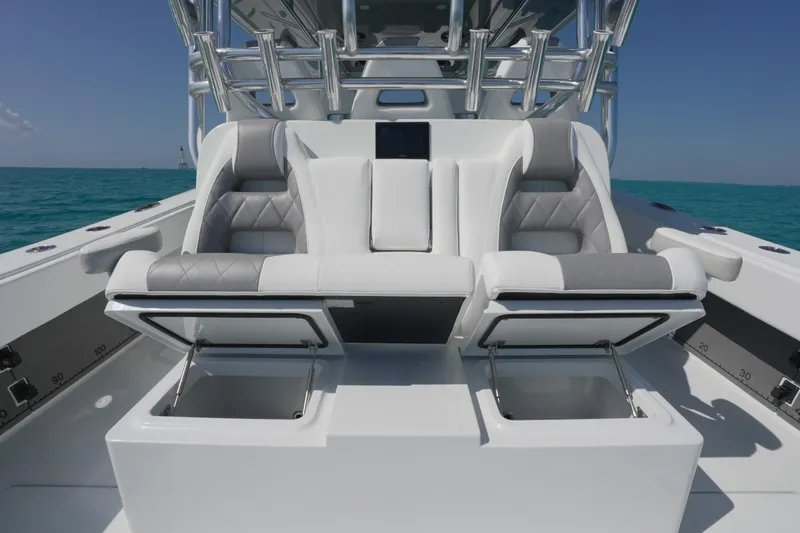  Yacht Photos Pics Luxurious seating on 2024 Freeman 42 boat with ocean backdrop.