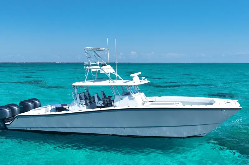  Yacht Photos Pics 2024 Freeman 42 boat on clear turquoise water under blue sky.