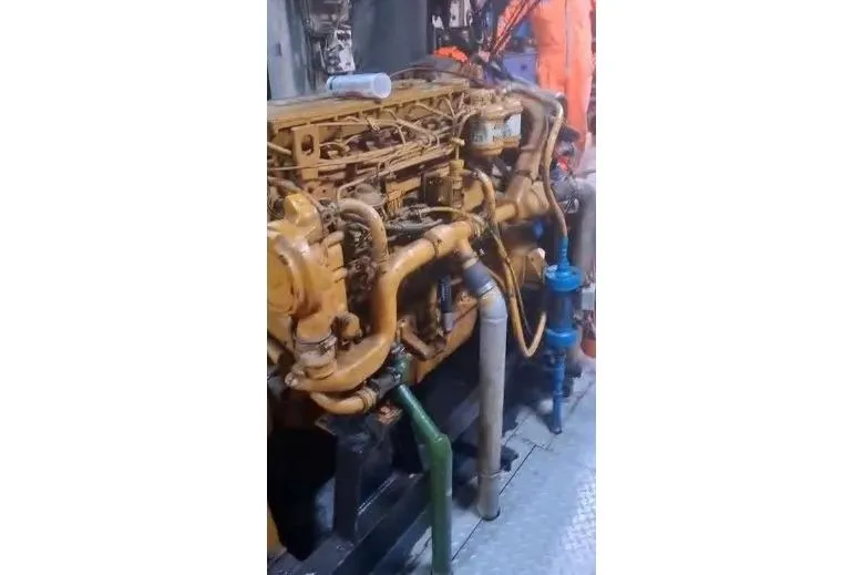  Yacht Photos Pics Engine room of a 2004 custom-built offshore crew vessel, showcasing machinery and piping.