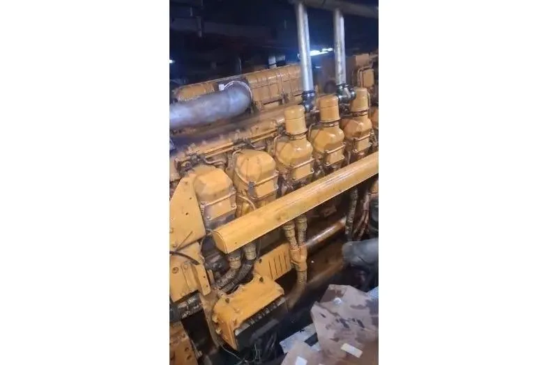  Yacht Photos Pics Engine room of a 2004 custom-built offshore crew vessel, showcasing machinery components.