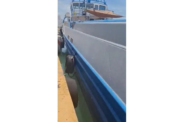  Yacht Photos Pics Custom built offshore crew vessel, 2004, docked with blue and gray exterior.