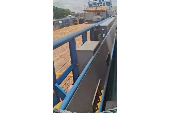  Yacht Photos Pics Custom built offshore crew vessel from 2004 with blue railings and wooden deck.