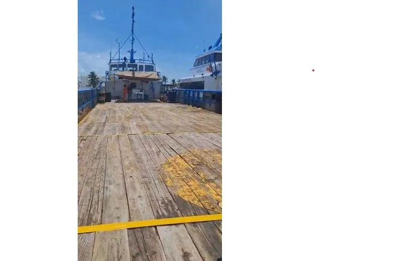  Yacht Photos Pics Custom built offshore crew vessel deck, 2004 model, with wooden planks and clear blue sky.