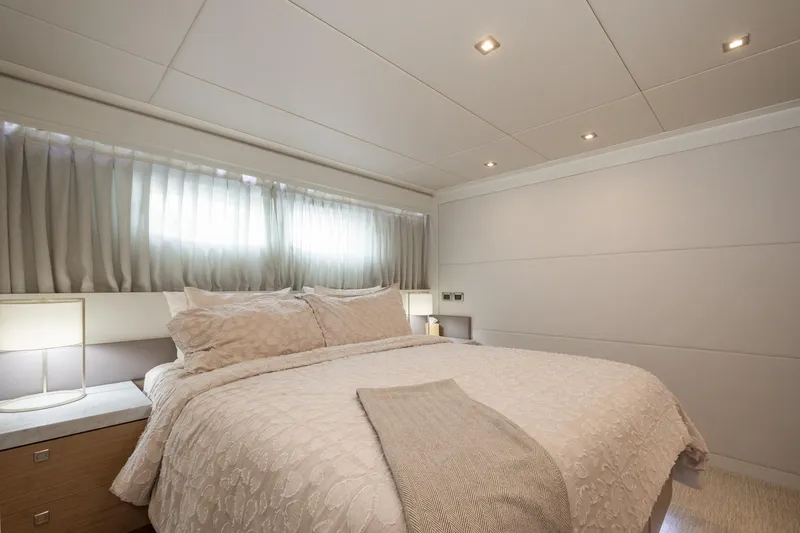 Seaseid Yacht Photos Pics Luxurious bedroom interior on 2016 Hargrave Flybridge Motor Yacht, featuring elegant bedding and soft lighting.