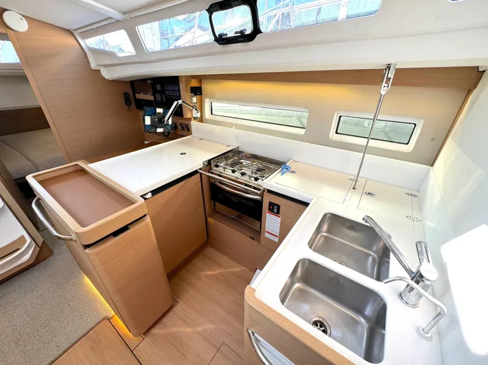 Leopolis Yacht Photos Pics Interior of Jeanneau Sun Odyssey 440 yacht kitchen, 2019 model.