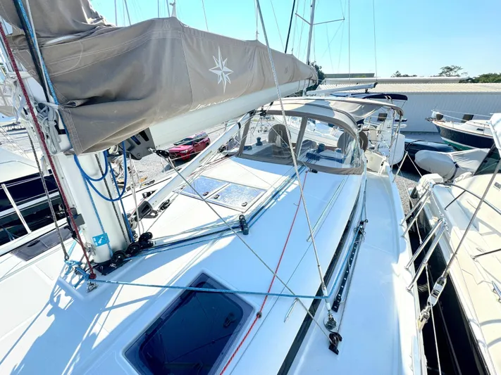 Leopolis Yacht Photos Pics Jeanneau Sun Odyssey 440 sailboat, 2019 model, docked under sunny skies.