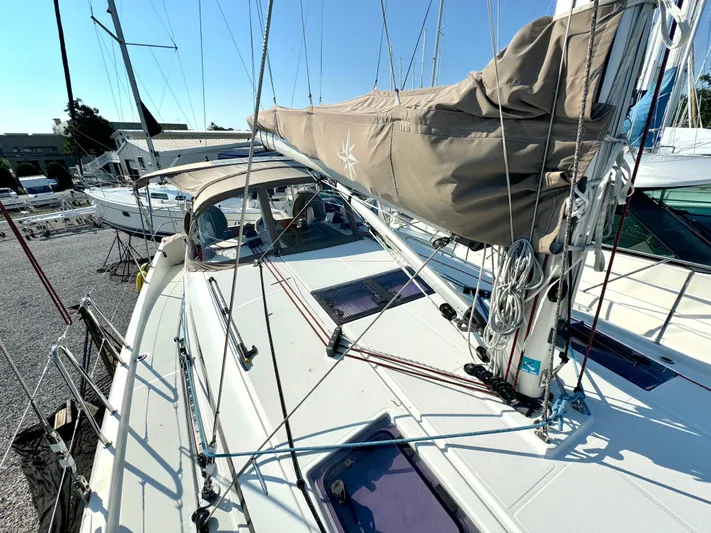 Leopolis Yacht Photos Pics Jeanneau Sun Odyssey 440 sailboat, 2019 model, docked at marina.