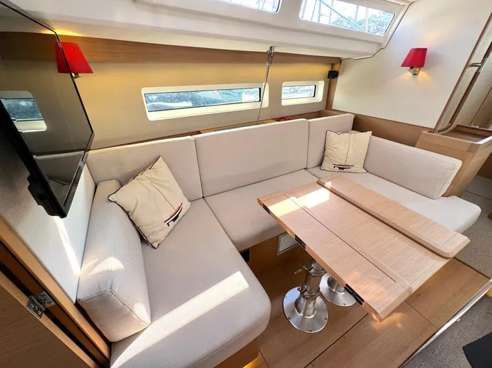 Leopolis Yacht Photos Pics Interior of 2019 Jeanneau Sun Odyssey 440 with cozy seating area.