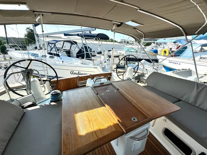 Leopolis Yacht Photos Pics Jeanneau Sun Odyssey 440, 2019, featuring cockpit view and wooden table.