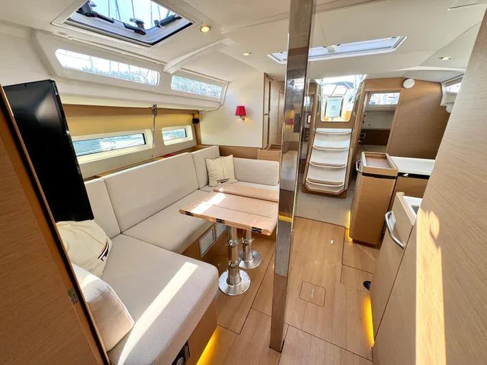 Leopolis Yacht Photos Pics Interior of 2019 Jeanneau Sun Odyssey 440 Performance yacht, featuring modern seating and natural lighting.