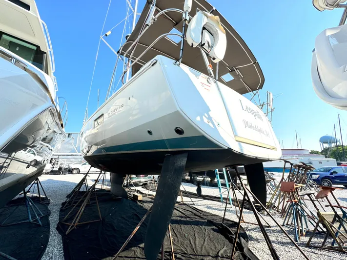 Leopolis Yacht Photos Pics 2019 Jeanneau Sun Odyssey 440 Performance sailboat on dry dock, side view.