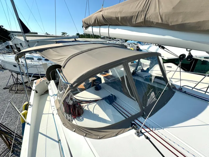 Leopolis Yacht Photos Pics 2019 Jeanneau Sun Odyssey 440 Performance sailboat with beige canopy and sleek design.