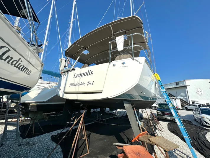 Leopolis Yacht Photos Pics 2019 Jeanneau Sun Odyssey 440 Performance sailboat on dry dock, blue sky background.