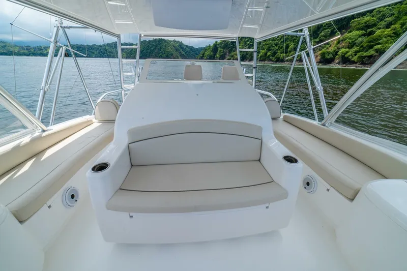 Galati Yacht Sales Trade Yacht Photos Pics Luxurious seating area on a 2021 Viking 58 Convertible yacht, with scenic water views.