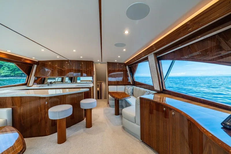 Galati Yacht Sales Trade Yacht Photos Pics Luxurious interior of 2021 Viking 58 Convertible yacht with ocean view.
