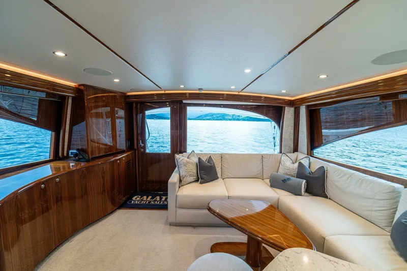 Galati Yacht Sales Trade Yacht Photos Pics Luxurious interior of 2021 Viking 58 Convertible yacht with elegant seating and scenic ocean view.