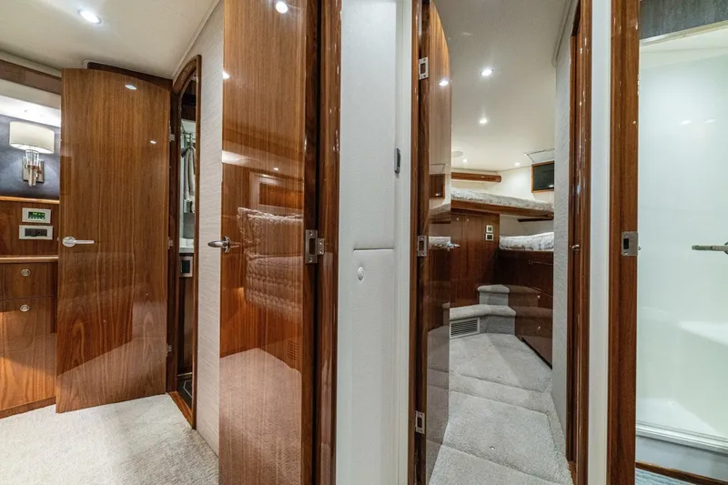 Galati Yacht Sales Trade Yacht Photos Pics Luxurious interior of 2021 Viking 58 Convertible yacht with polished wood finishes.