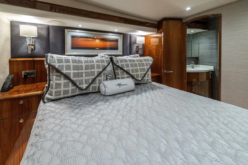 Galati Yacht Sales Trade Yacht Photos Pics Luxurious bedroom interior of 2021 Viking 58 Convertible yacht with elegant decor.