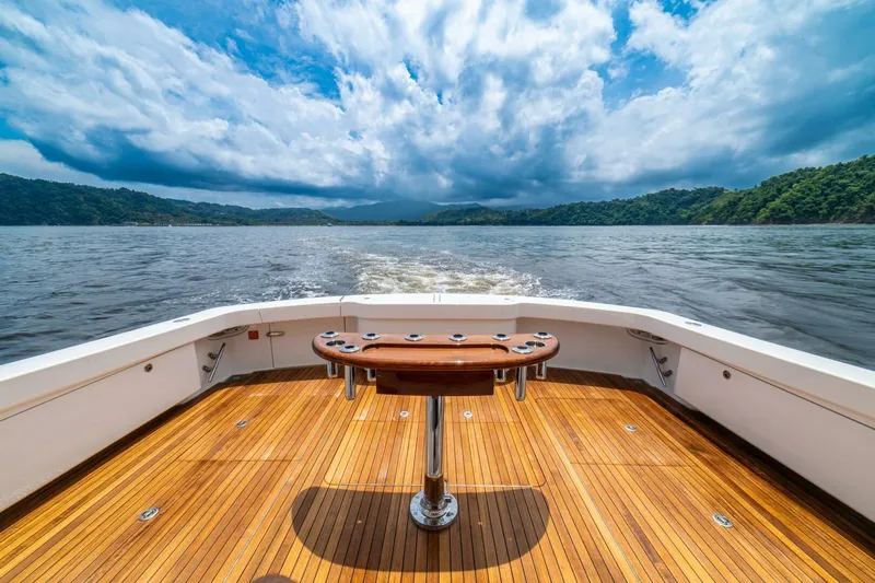 Galati Yacht Sales Trade Yacht Photos Pics 2021 Viking 58 Convertible yacht deck with scenic ocean view and cloudy sky.