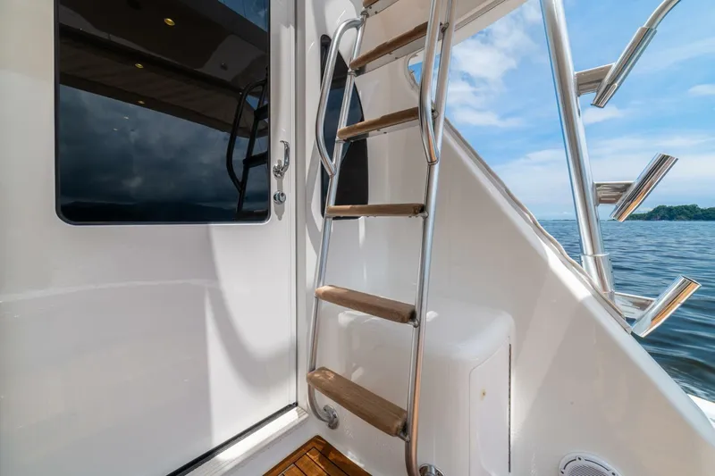 Galati Yacht Sales Trade Yacht Photos Pics Stainless steel and wood ladder on 2021 Viking 58 Convertible yacht, ocean view.