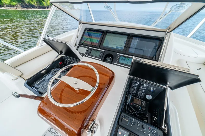 Galati Yacht Sales Trade Yacht Photos Pics Cockpit of 2021 Viking 58 Convertible yacht with advanced navigation systems.