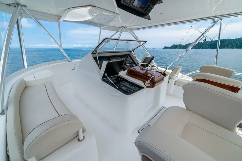 Galati Yacht Sales Trade Yacht Photos Pics 2021 Viking 58 Convertible yacht interior with ocean view, featuring modern helm and seating.