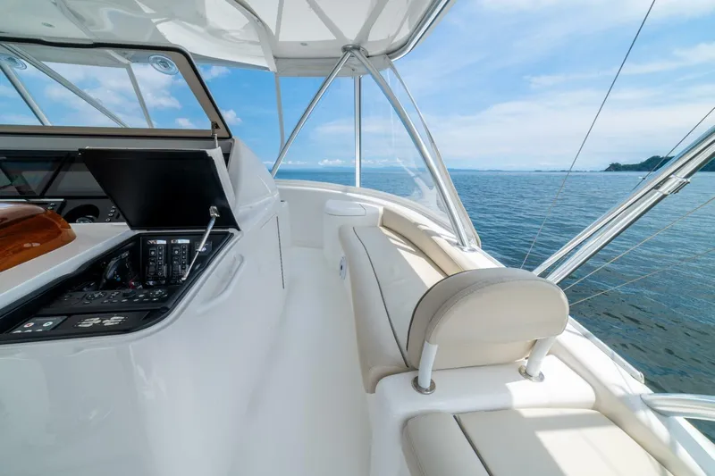 Galati Yacht Sales Trade Yacht Photos Pics 2021 Viking 58 Convertible yacht helm with ocean view, featuring modern controls and seating.