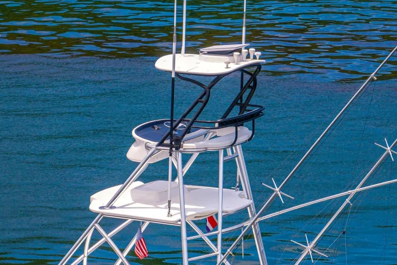 Galati Yacht Sales Trade Yacht Photos Pics Tower of 2021 Viking 58 Convertible yacht against blue water background.