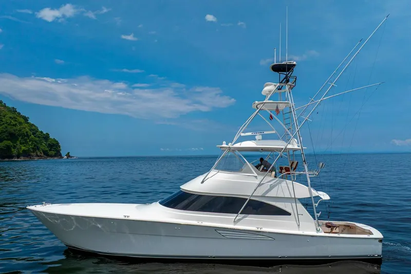 Galati Yacht Sales Trade Yacht Photos Pics 2021 Viking 58 Convertible yacht cruising on calm ocean waters.