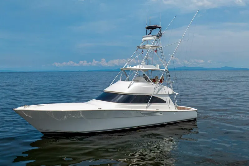 Galati Yacht Sales Trade Yacht Photos Pics 2021 Viking 58 Convertible yacht cruising on calm ocean waters.