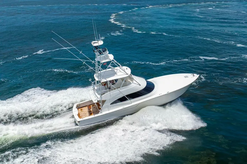 Galati Yacht Sales Trade Yacht Photos Pics 2021 Viking 58 Convertible yacht cruising on open water.