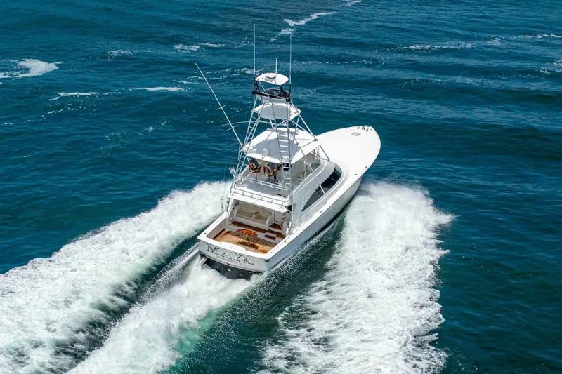 Galati Yacht Sales Trade Yacht Photos Pics 2021 Viking 58 Convertible yacht cruising on open blue waters.