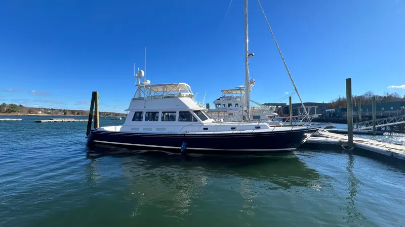 La Vie Dansante Yacht Photos Pics 1998 Little Harbor WhisperJet 55 yacht docked in a sunny marina.