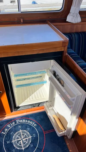 La Vie Dansante Yacht Photos Pics Open mini fridge inside 1998 Little Harbor WhisperJet 55 yacht interior.