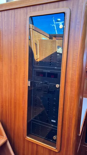 La Vie Dansante Yacht Photos Pics Control panel on a 1998 Little Harbor WhisperJet 55 yacht, featuring a sleek wooden finish.